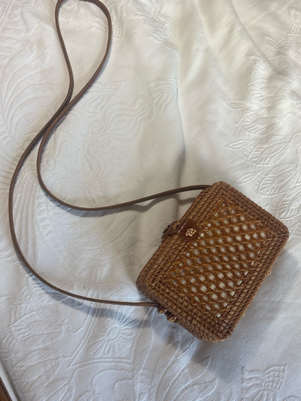 Brown woven crossbody bag